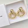 A pair of gold-filled chunky braided hoop earrings presented in a white box with the text 'JACKSON & CO Collection'.