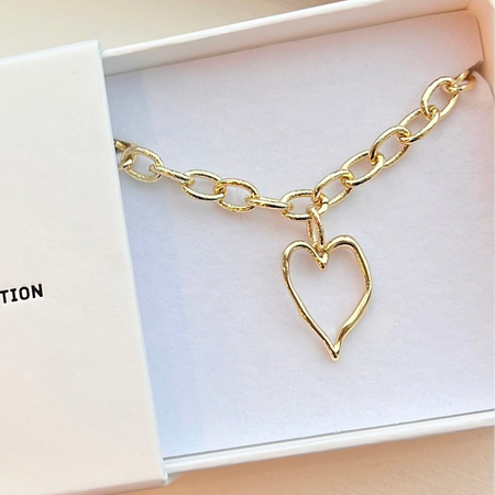 A gold-filled rope style chain heart bracelet with a twisted rope design, presented in a white box with 'The Christy F Collection' branding.