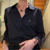 Woman wearing a black shirt with a blurred background