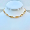 A gold-filled rope style choker necklace with citrine gemstone connectors displayed on a white mannequin neck.
