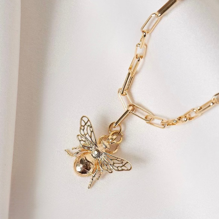 Gold filled paperclip style chain necklace with a large gold filled bee charm.