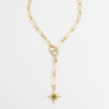 Gold necklace with a star pendant on a white background