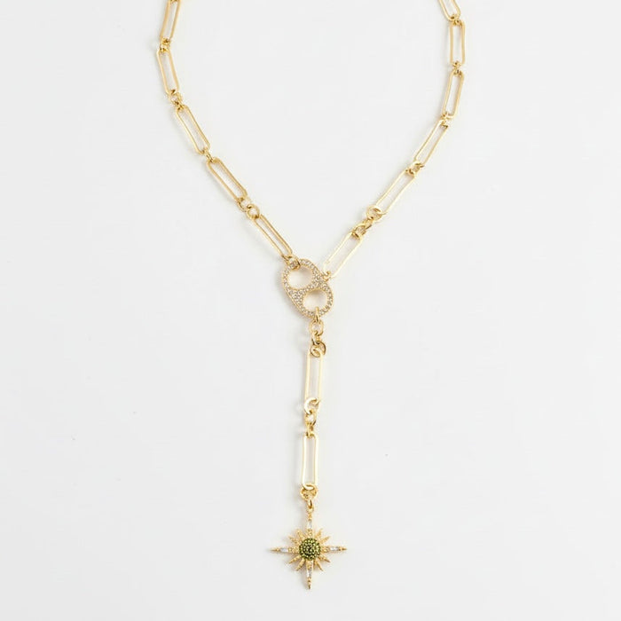 Gold necklace with a star pendant on a white background