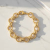 Gold chain bracelet on a marble surface