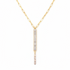 Gold necklace with a bar-shaped pendant on a white background