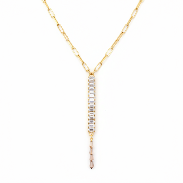 Gold necklace with a bar-shaped pendant on a white background