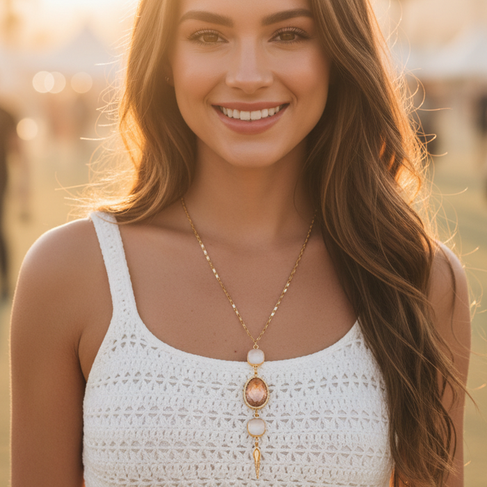 Woman wearing a white crochet top with a blurred background