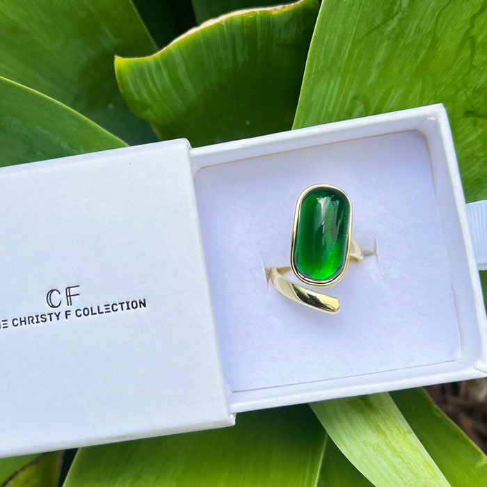 Green ring in a white box with 'CF' branding, surrounded by green leaves.