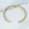 Gold chain headband on a marble surface