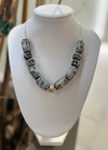 Necklace with decorative beads on a mannequin bust