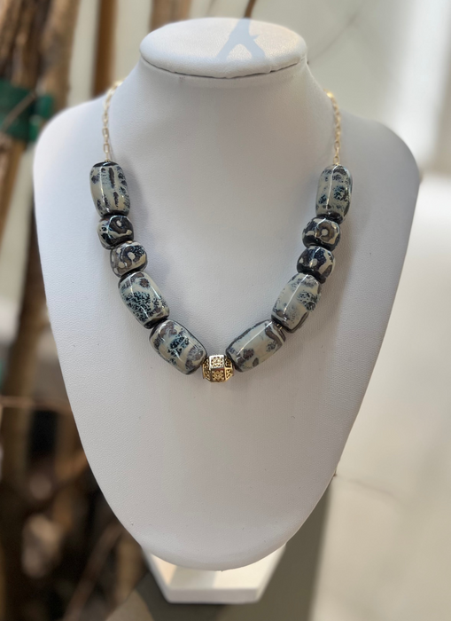 Necklace with decorative beads on a mannequin bust