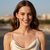 Woman wearing a beige dress with a blurred background
