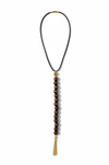 Wanderlust Lariat flat lay showing tiger's eye connector, wooden beads and gold chain tassel