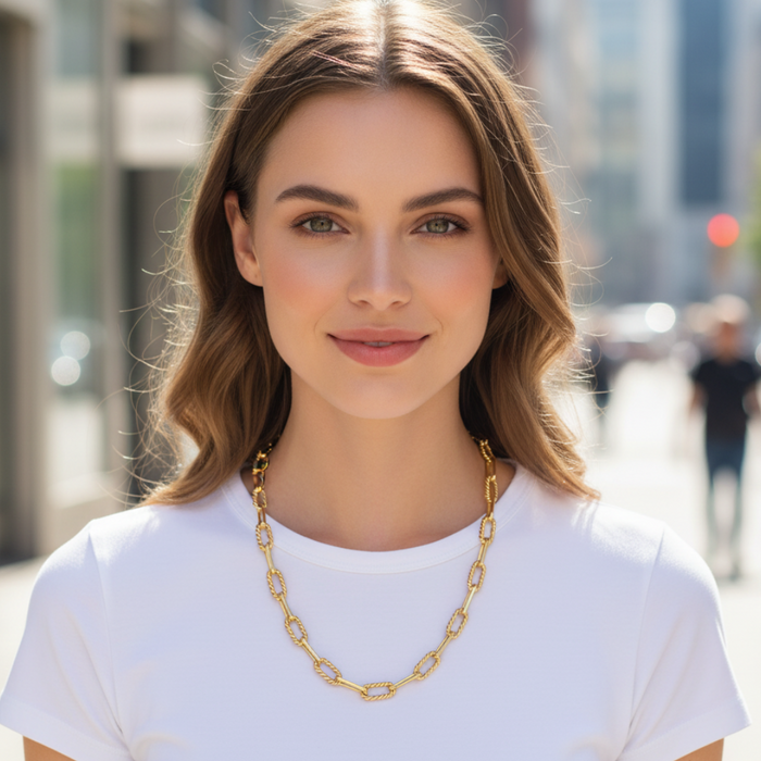 Woman wearing a gold chain necklace in an urban setting
