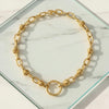 Gold chain necklace on a marble surface