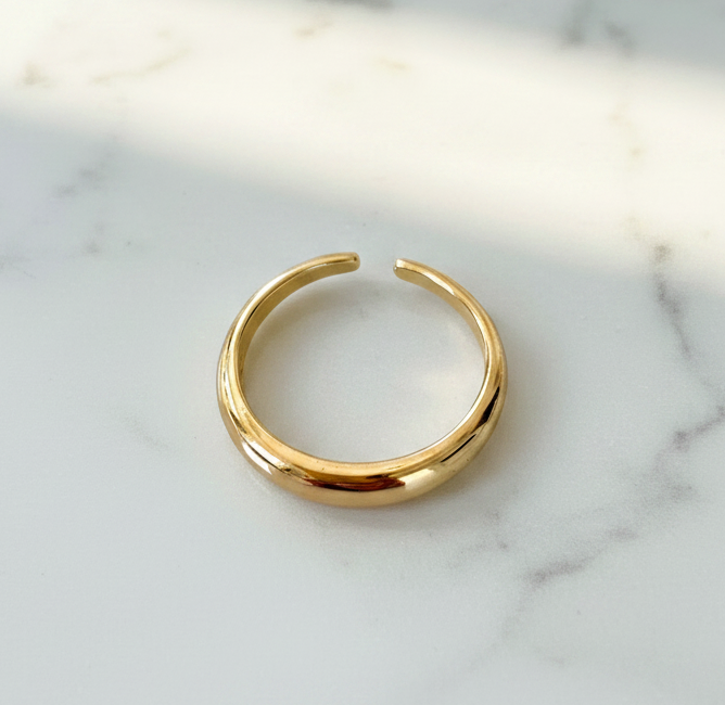 Gold ring on a marble surface