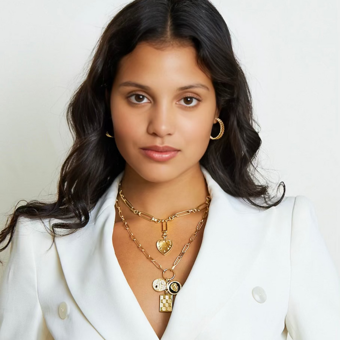 Falling in Love gold-filled heart medallion necklace on paperclip chain worn on model wearing white - The Christy F Collection